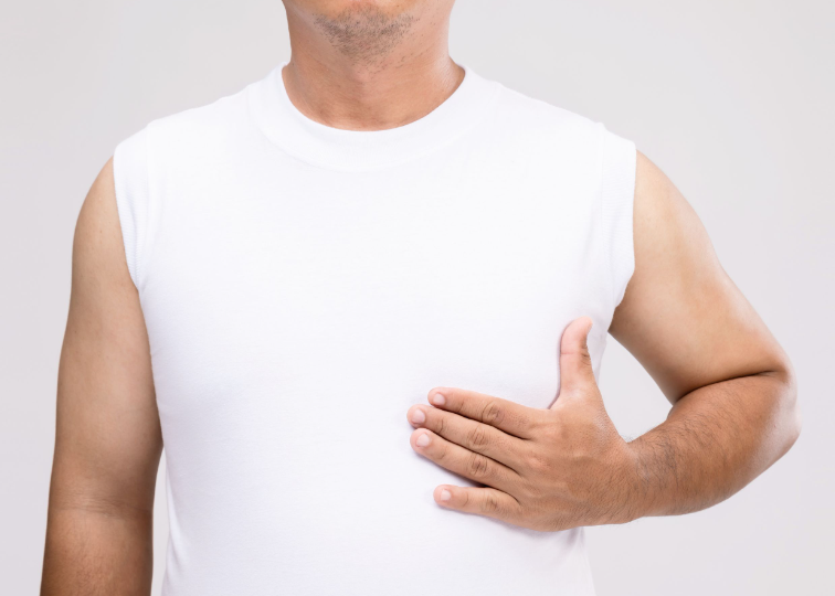 What is gynecomastia and who does it affect?